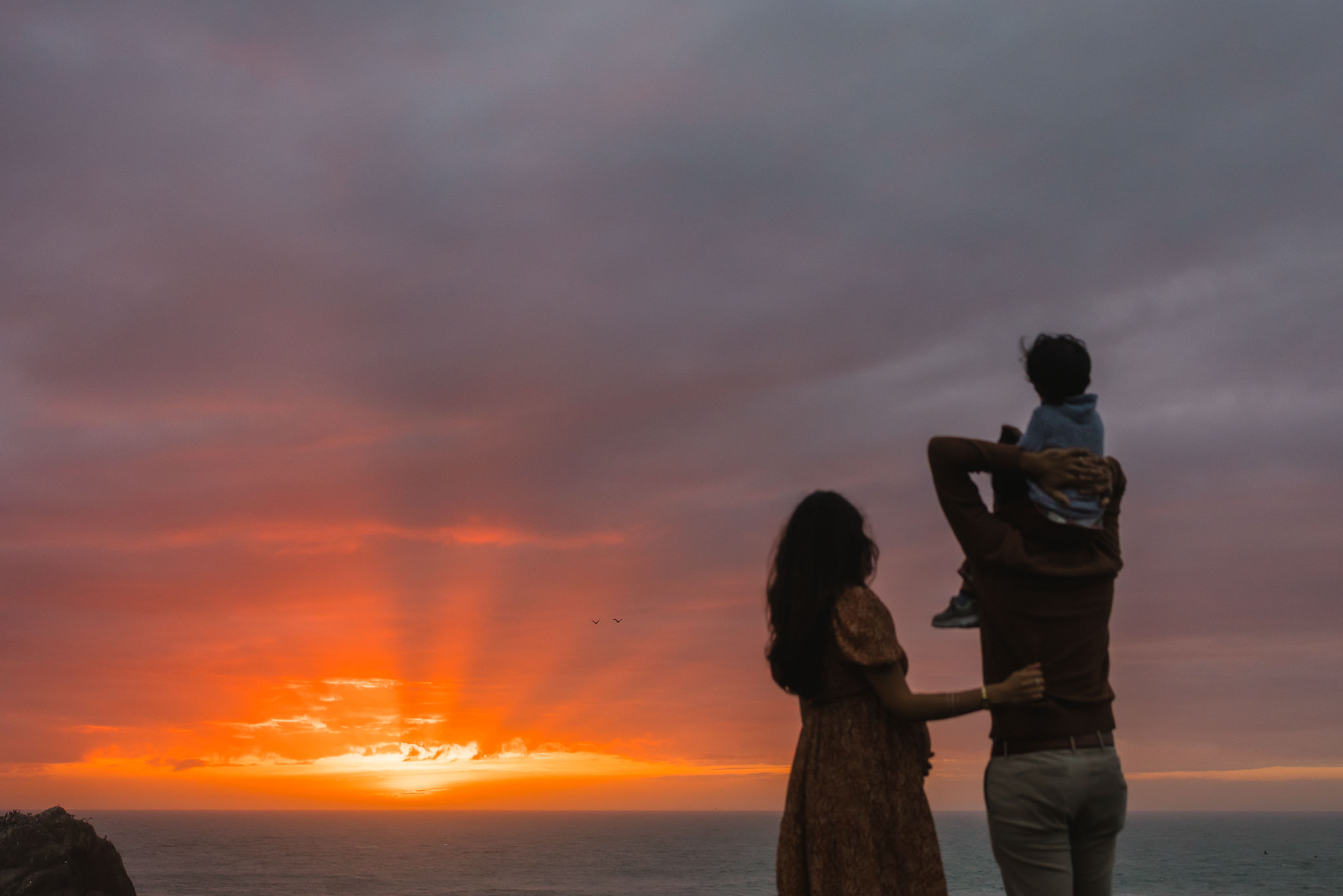 San Francisco family watches sunset at Lands End