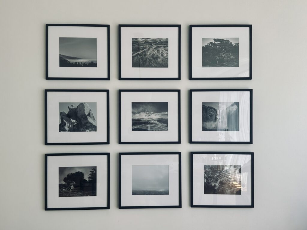 Gallery wall display of 9 fine art black and white prints by Ashley Kaplan Photography